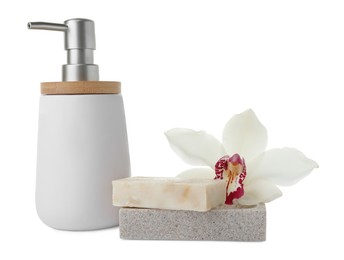 Dish with soap bar, liquid dispenser and beautiful lily on white background