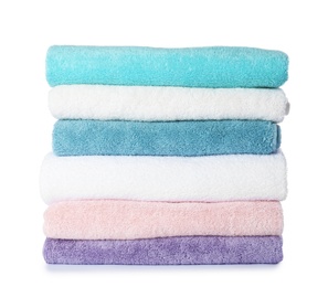 Stack of folded towels on white background