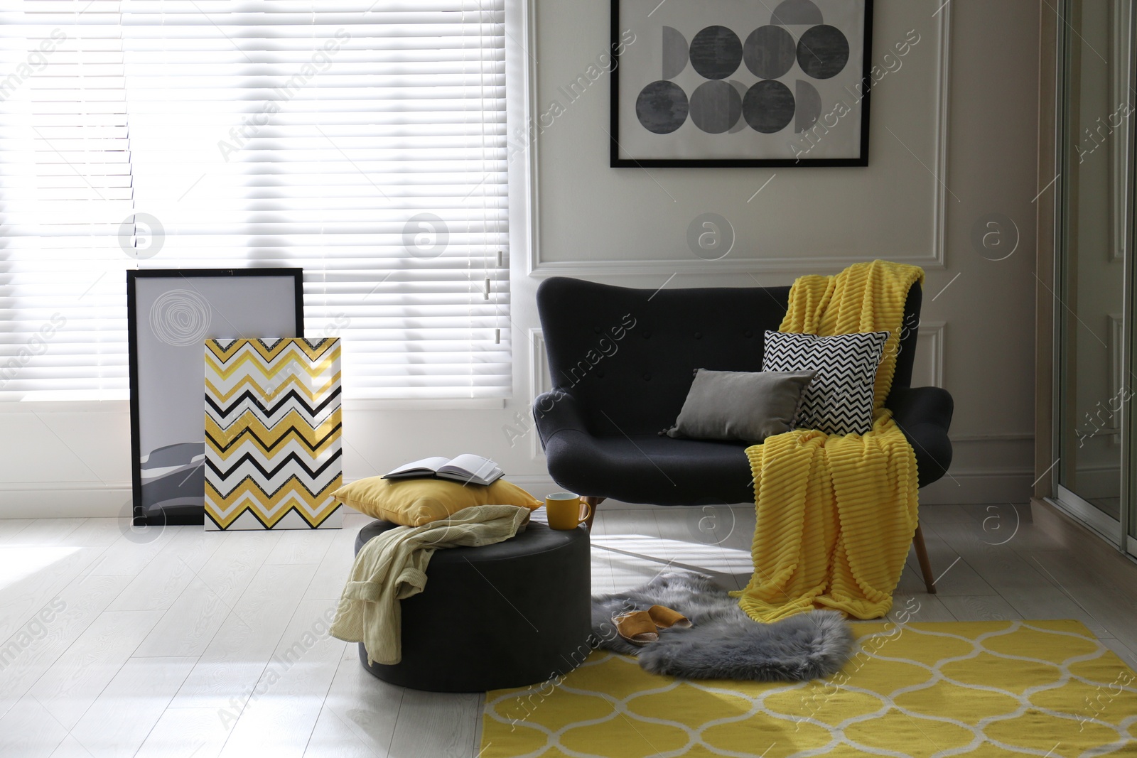 Photo of Comfortable sofa with pillows and plaid in living room. Interior design