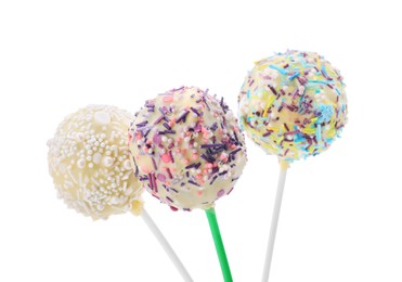 Photo of Delicious confectionery. Sweet cake pops decorated with sprinkles on white background