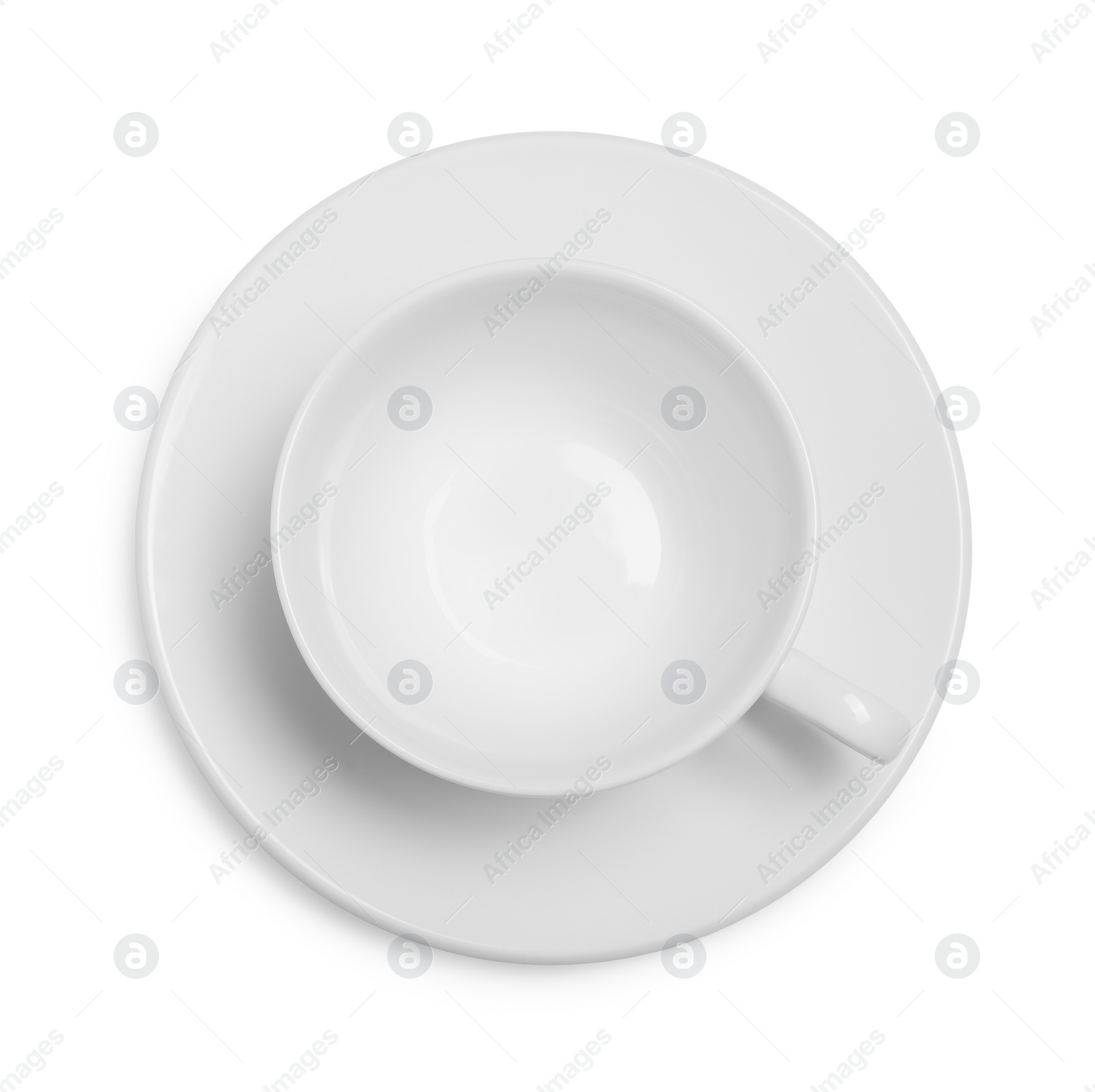 Photo of Ceramic cup with saucer isolated on white, top view