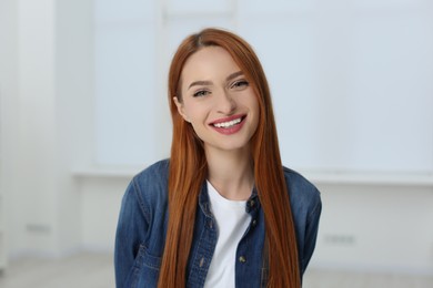 Portrait of beautiful young woman at home