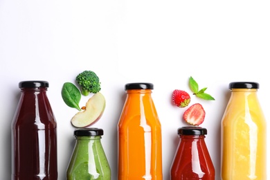 Photo of Flat lay composition with bottles of colorful juices and fresh ingredients on white background