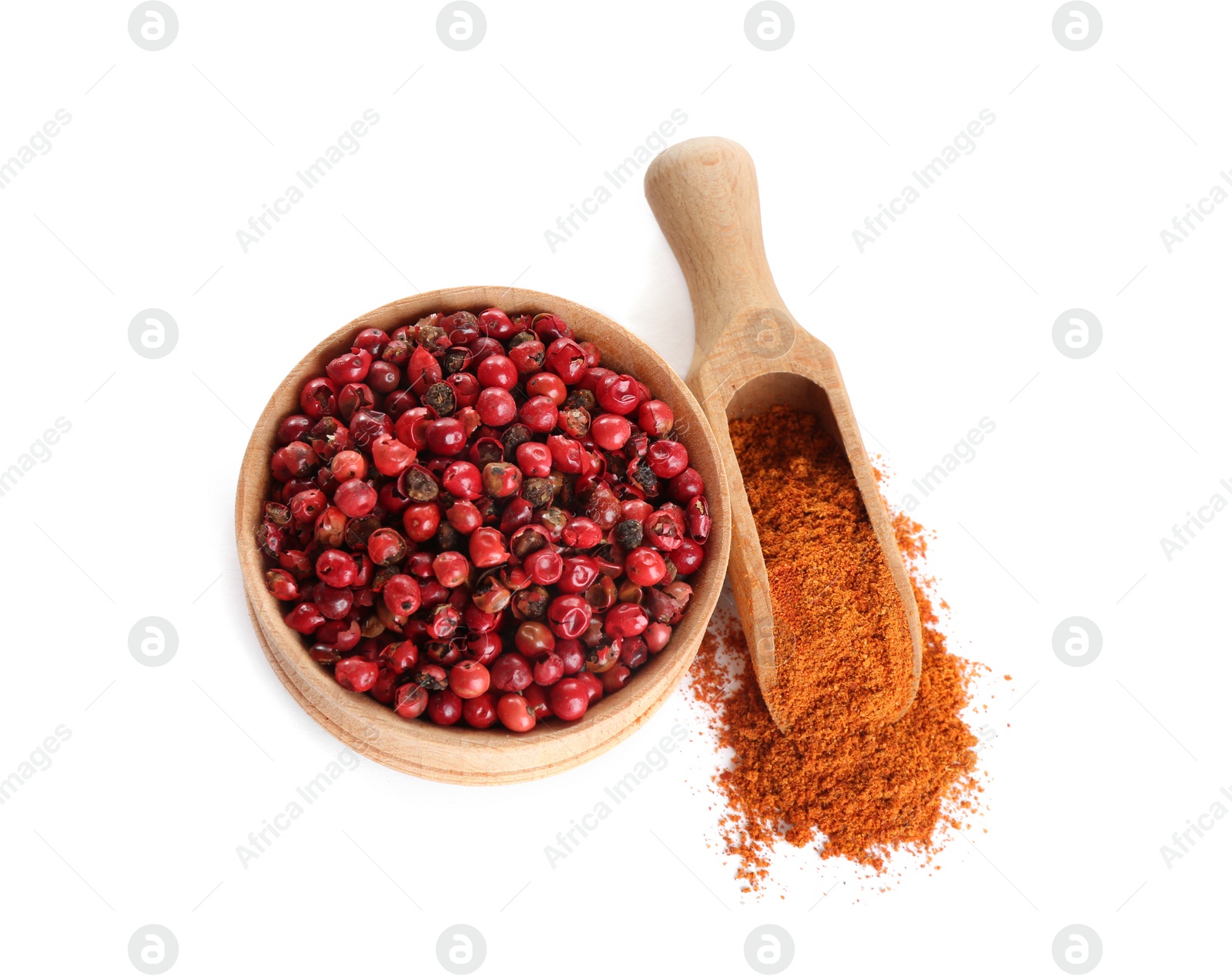 Photo of Ground red pepper and corns isolated on white, top view