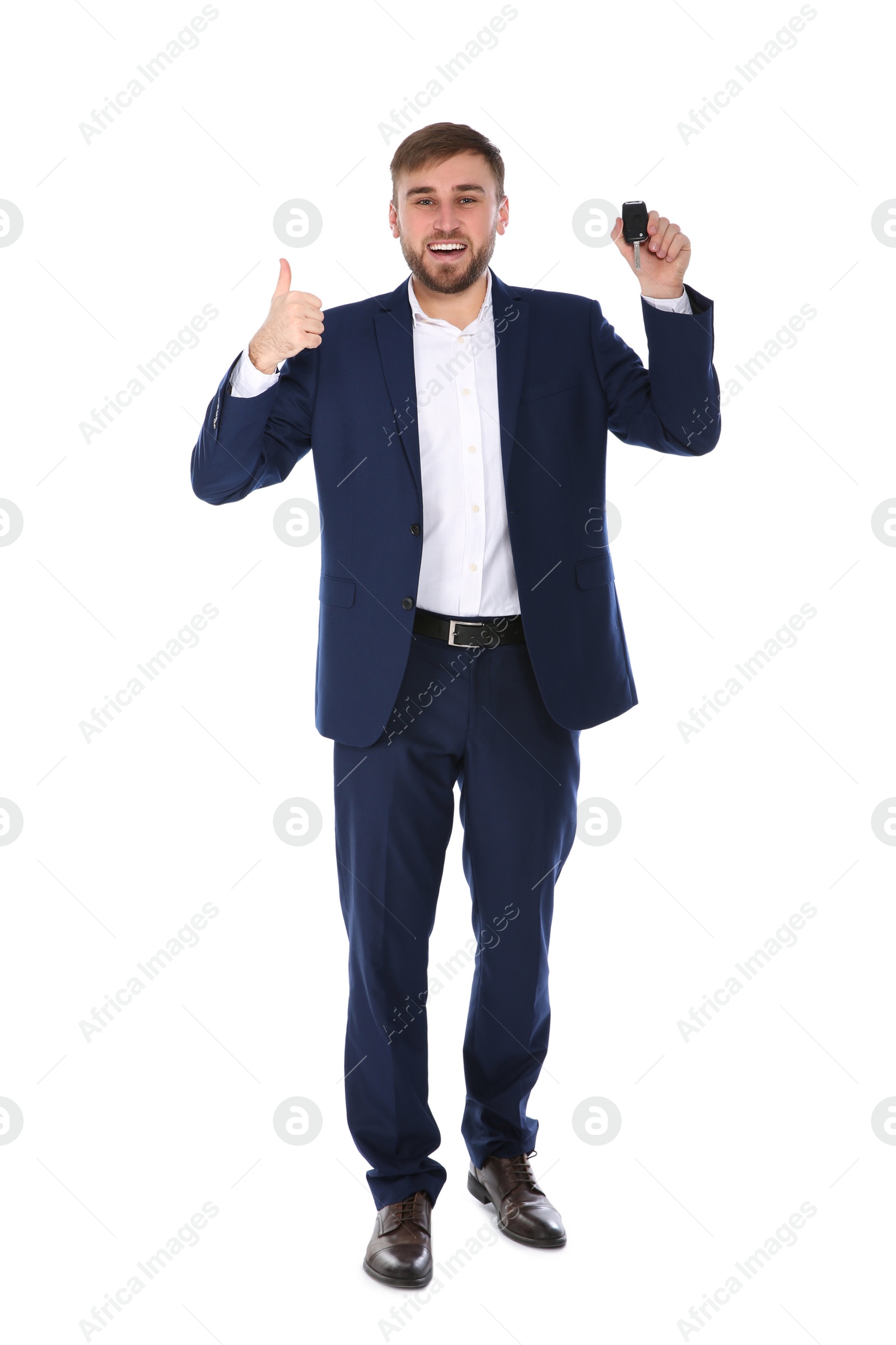 Photo of Happy young businessman with car key on white background