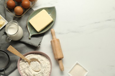 Photo of Flat lay composition with fresh butter among other products on white marble table. Space for text