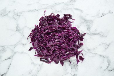 Photo of Tasty red cabbage sauerkraut on white marble table, top view