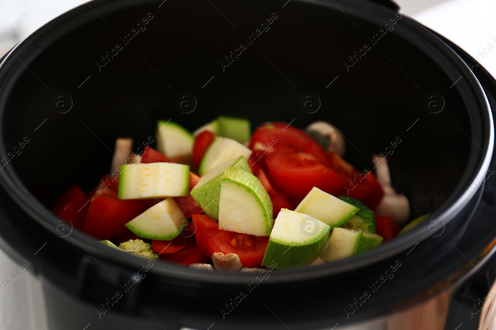 Photo of Closeup view of multi cooker with vegetables