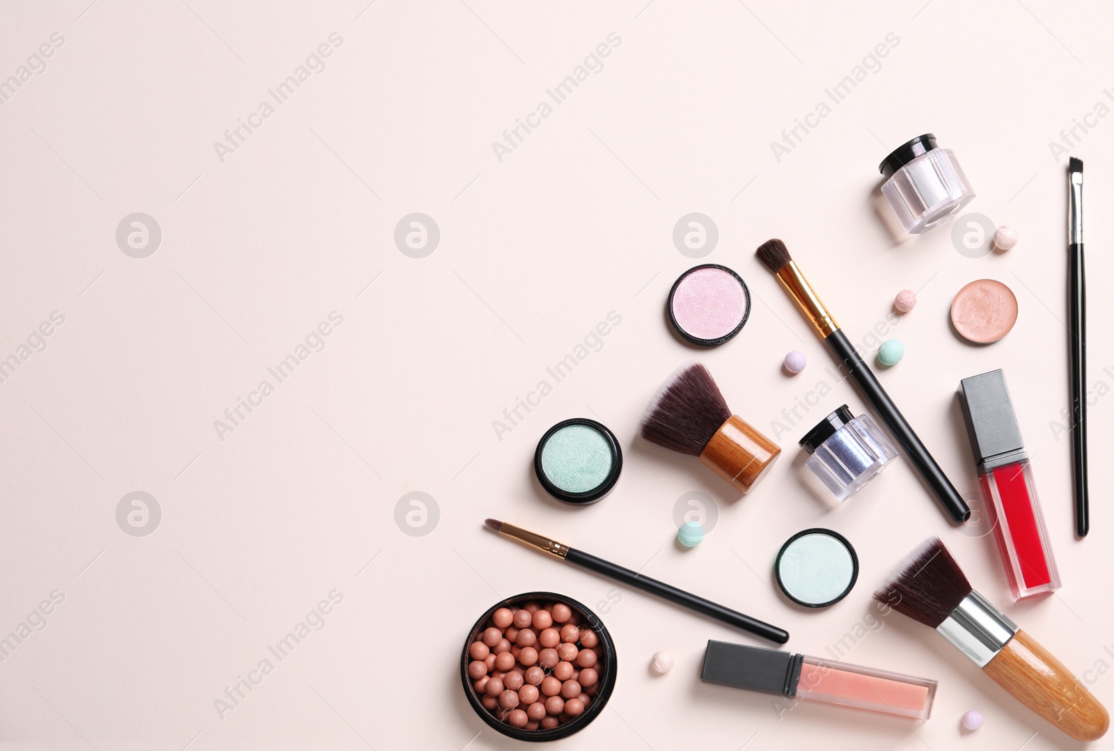 Photo of Flat lay composition with different cosmetic products on beige background. Space for text