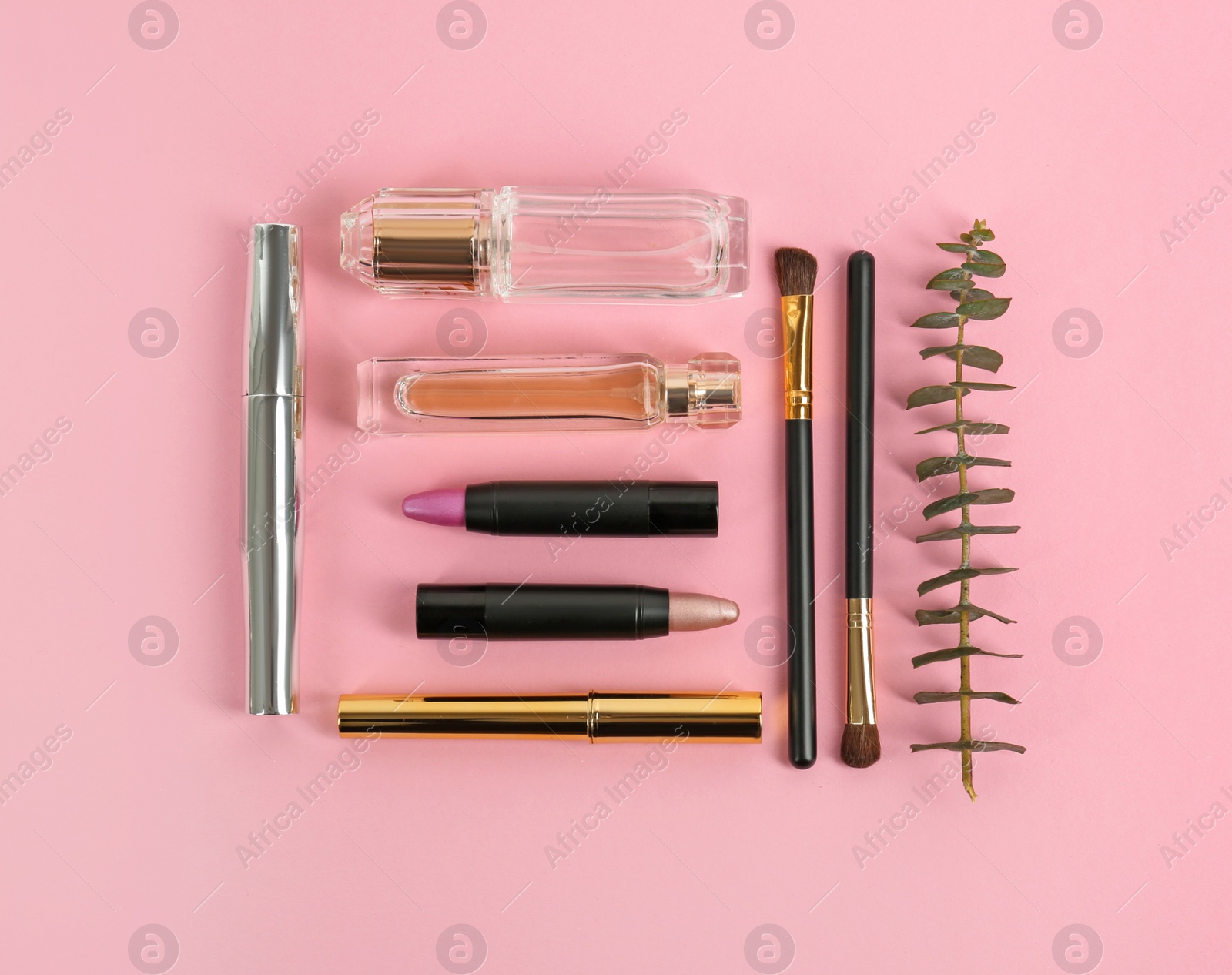 Photo of Flat lay composition with bright lipsticks and accessories on pink background