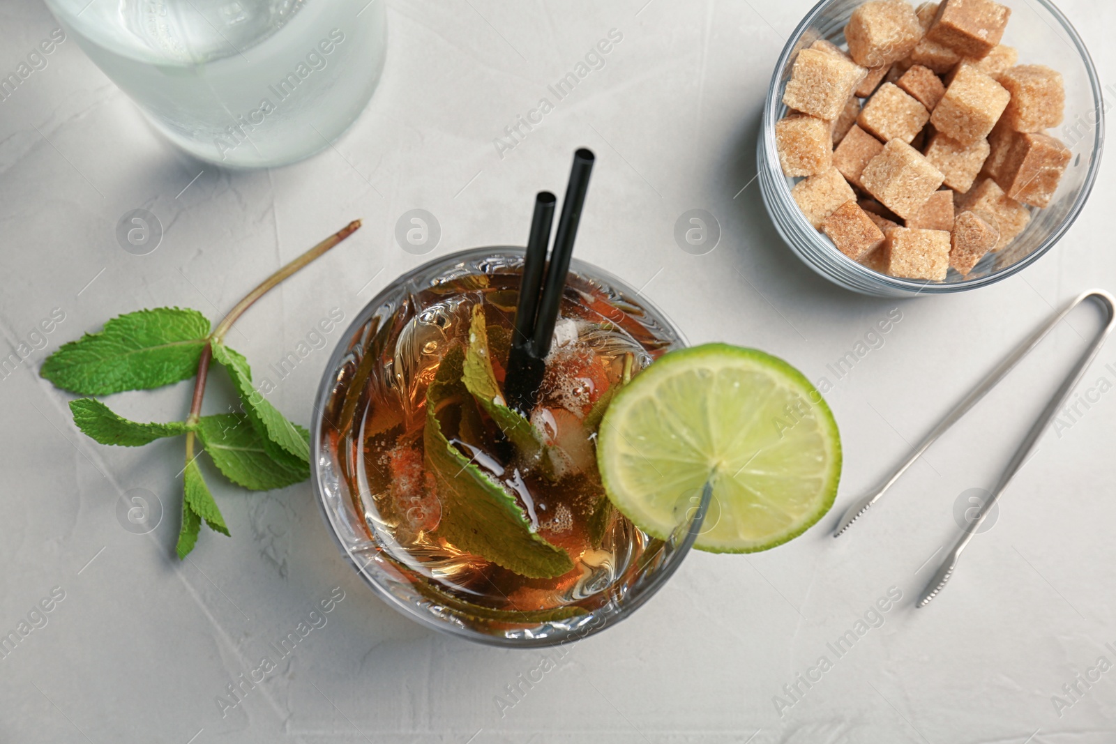 Photo of Flat lay composition with mint julep cocktail on light background