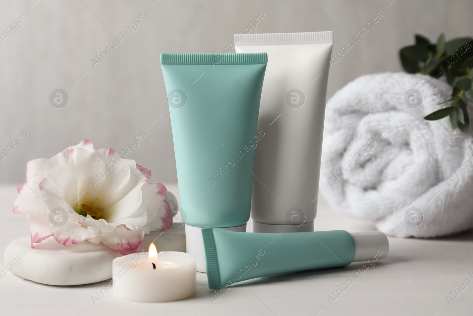 Photo of Composition with cosmetic products on white table