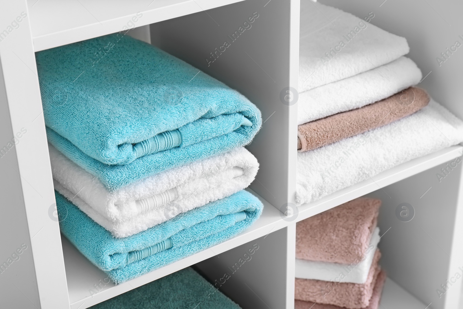 Photo of Clean towels on shelves