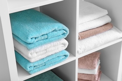 Photo of Clean towels on shelves