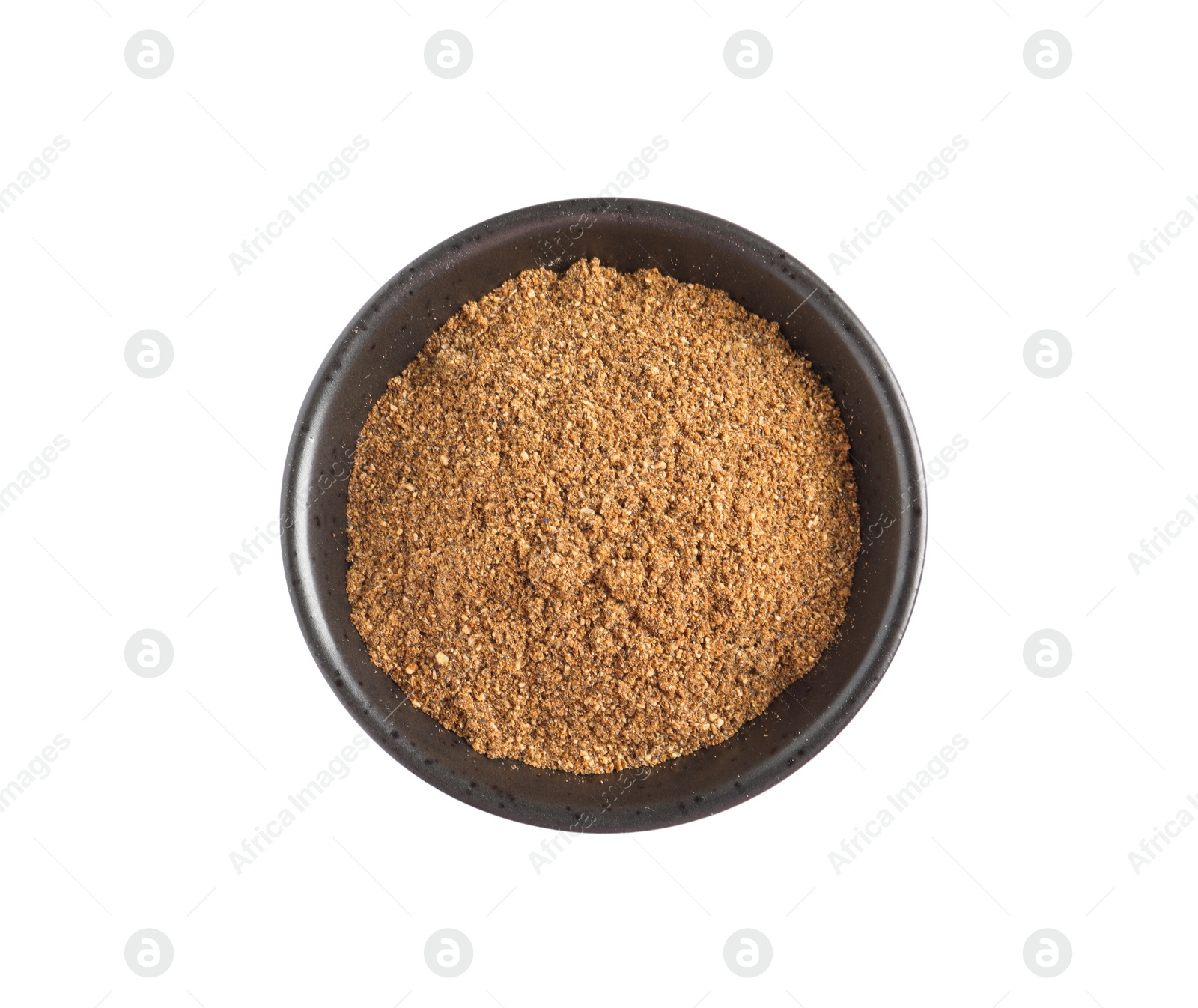 Photo of Bowl of aromatic caraway (Persian cumin) powder isolated on white, top view