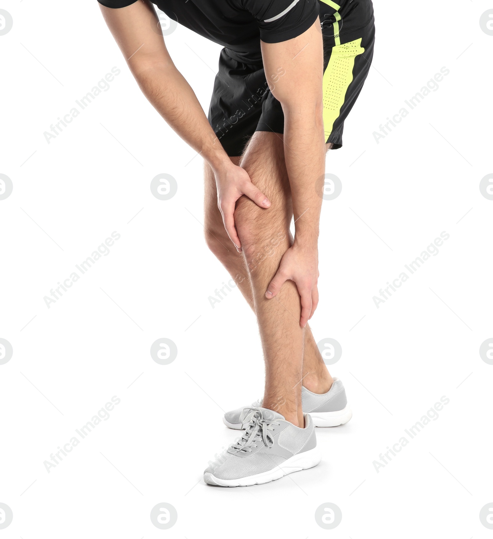 Photo of Man suffering from leg pain on white background, closeup