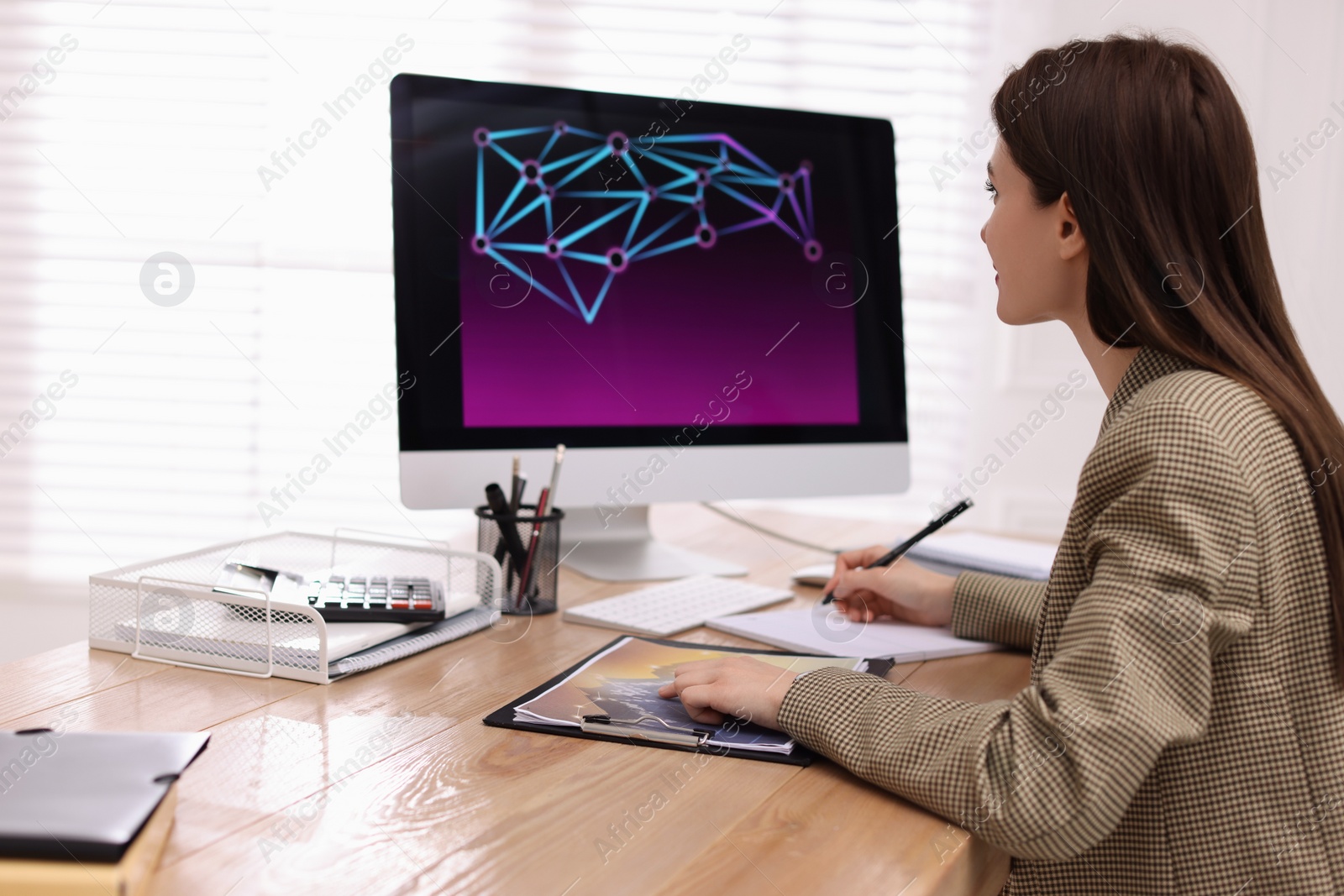 Photo of Businesswoman working at table in office. Forex trading