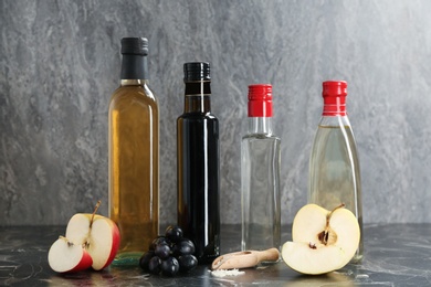 Composition with different kinds of vinegar and ingredients on table