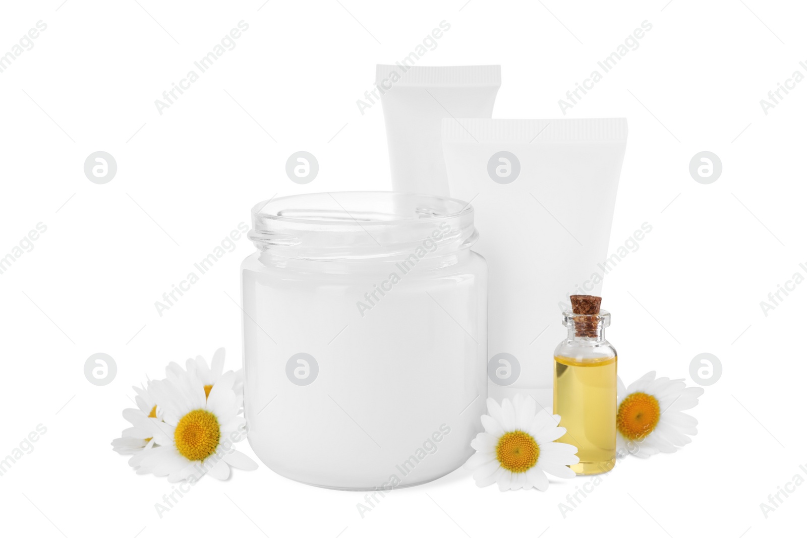 Photo of Different hand care cosmetic products and chamomiles on white background