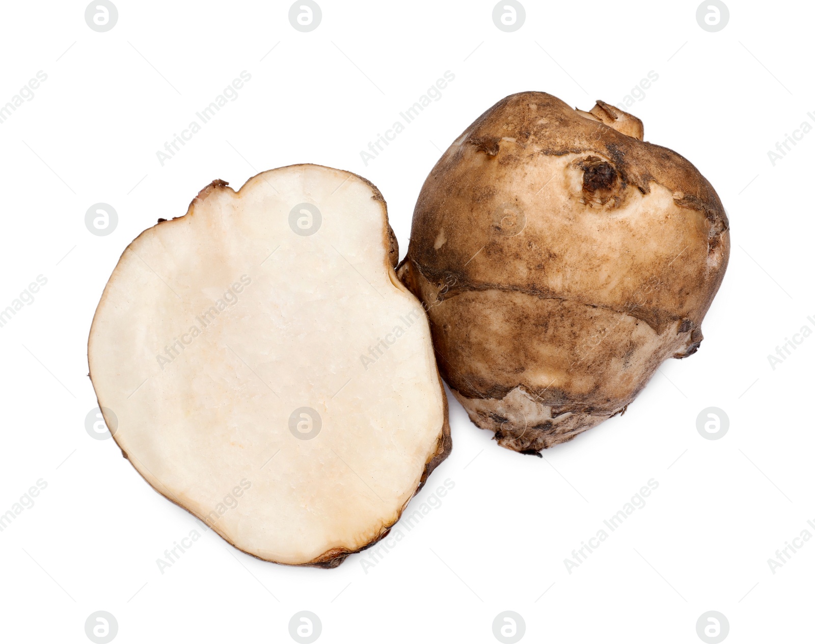 Photo of Whole and cut Jerusalem artichokes isolated on white, top view