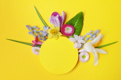 Photo of Flat lay composition with spring hyacinth flowers and blank card on color background, space for text