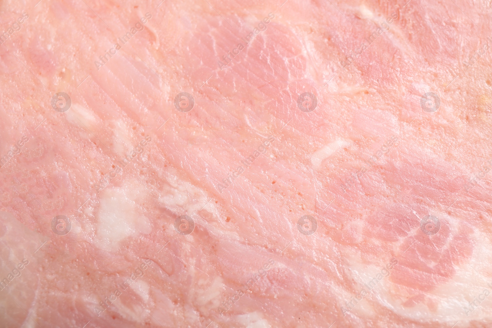 Photo of Tasty ham as background, closeup. Fresh delicacy