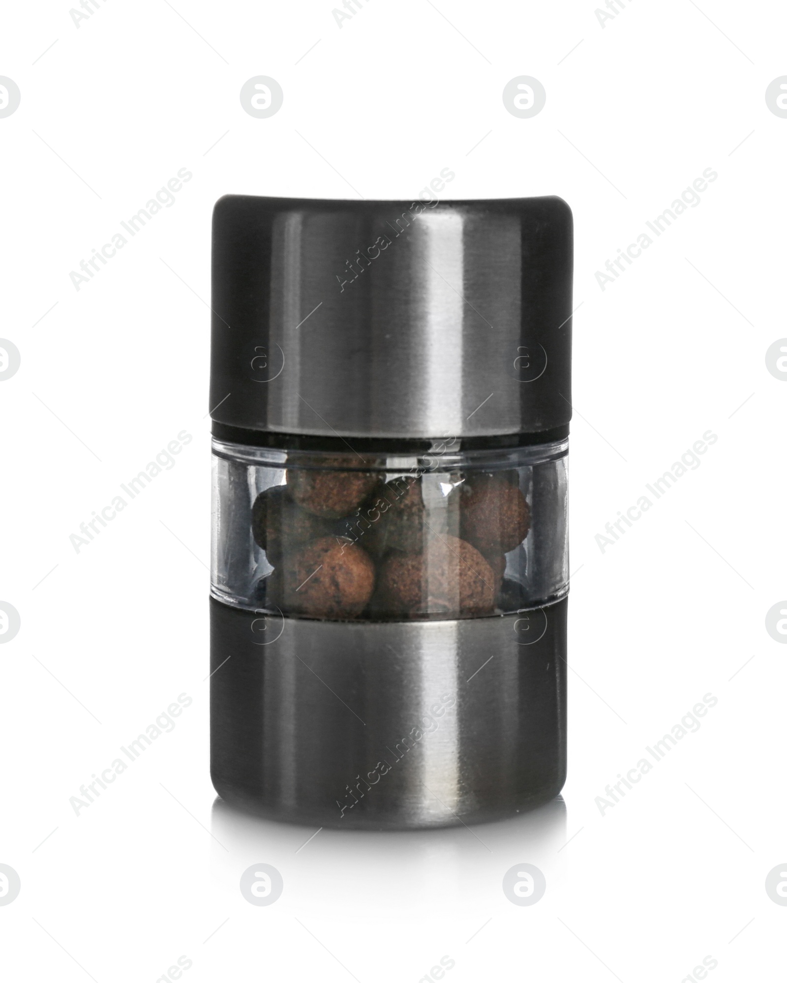 Photo of Manual grinder with allspice peppercorns on white background