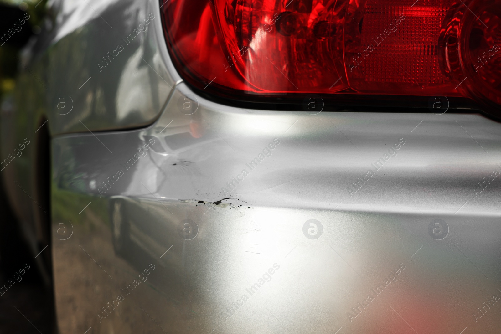 Photo of Modern gray car with scratch, closeup view