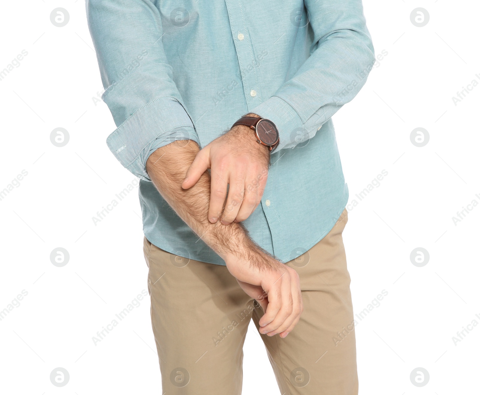 Photo of Young man scratching arm on white background, closeup. Annoying itch