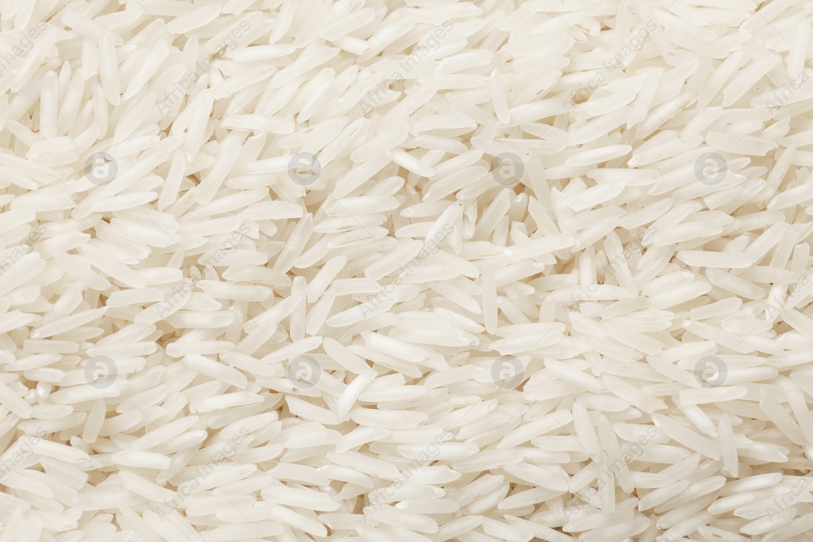 Photo of Raw basmati rice as background, top view