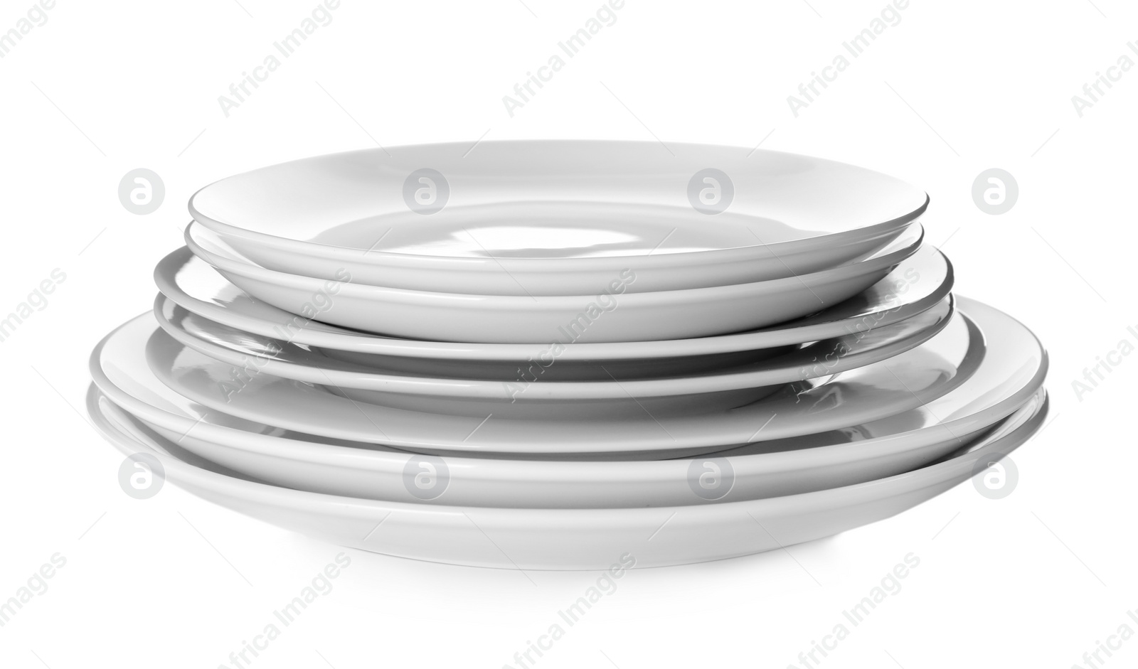 Photo of Stack of clean plates isolated on white