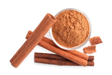 Dry aromatic cinnamon sticks and powder isolated on white, top view