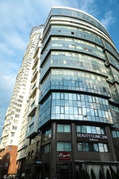 KYIV, UKRAINE - MAY 23, 2019: Modern office building and cars on city street