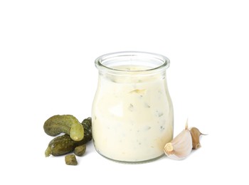 Tartar sauce and ingredients on white background