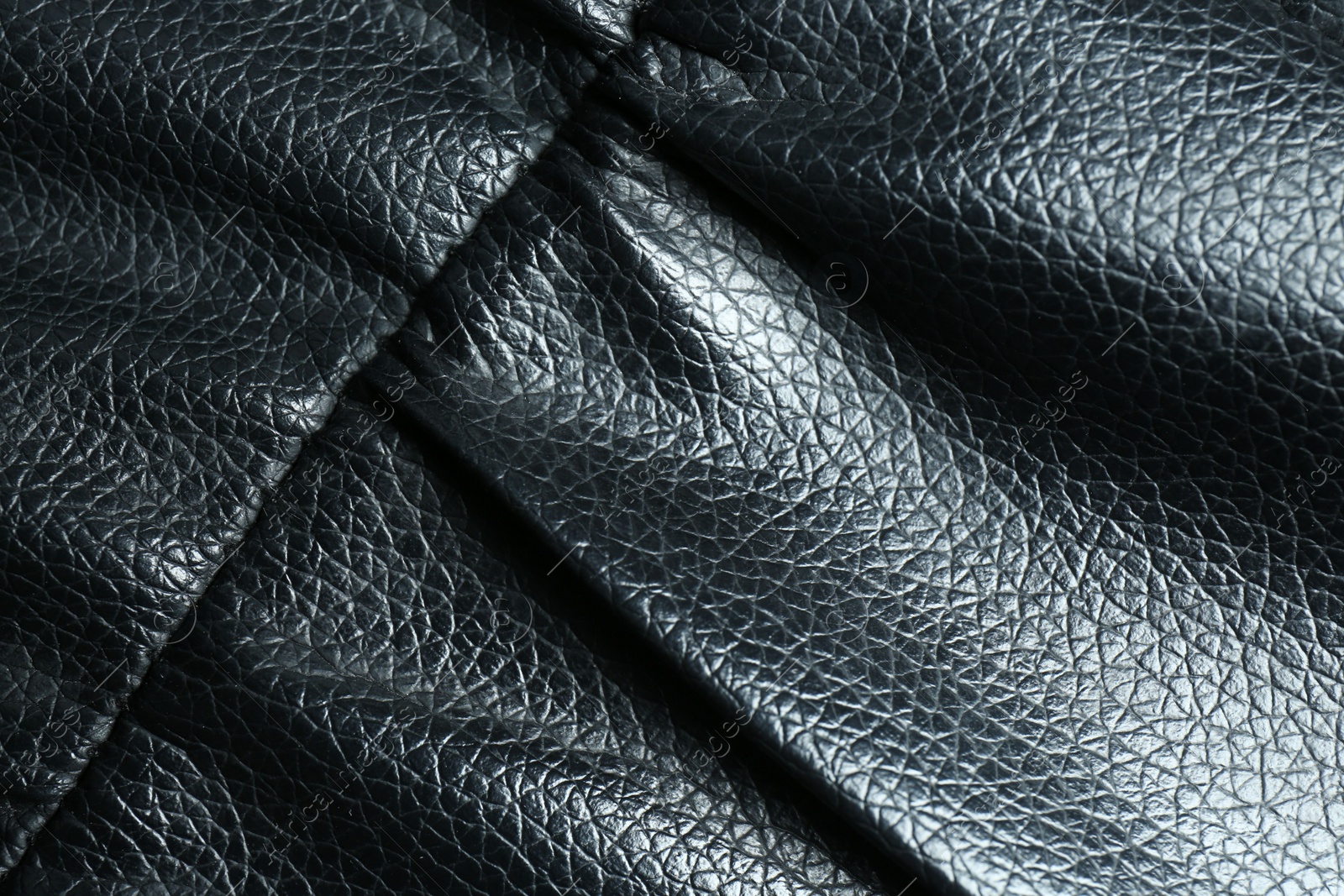 Photo of Black leather with seam as background, top view