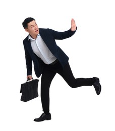 Photo of Businessman in suit with briefcase running on white background