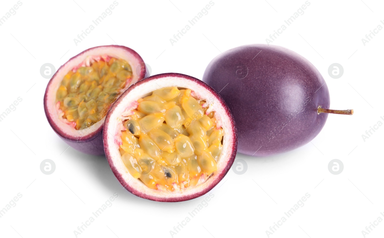 Photo of Cut and whole passion fruits on white background