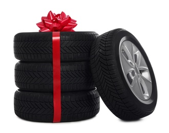 Gift set of wheels with winter tires on white background