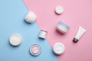 Photo of Flat lay composition with cosmetic products on color background
