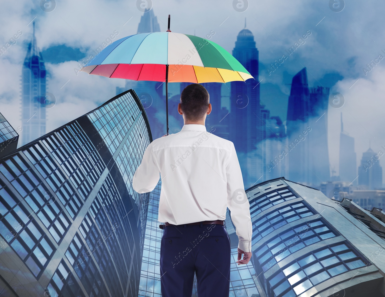 Image of Businessman with umbrella in city center. Insurance concept