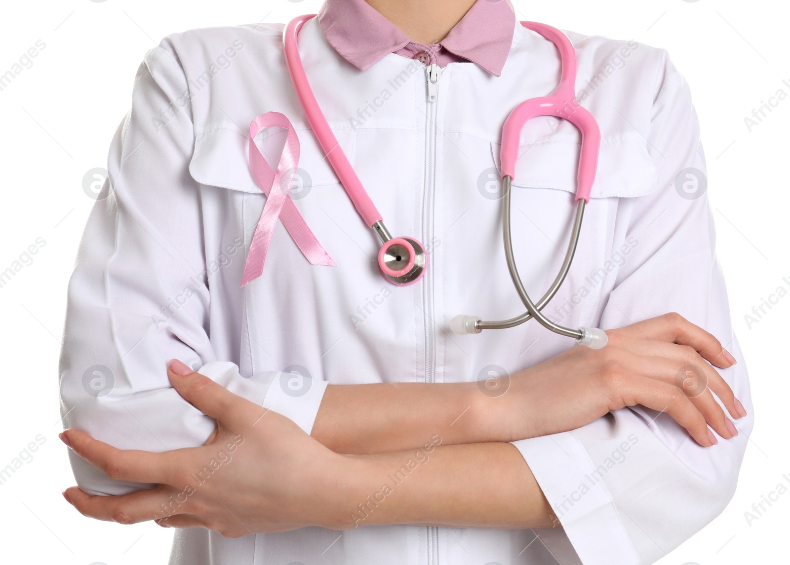 Photo of Doctor with pink ribbon and stethoscope on white background, closeup. Breast cancer awareness