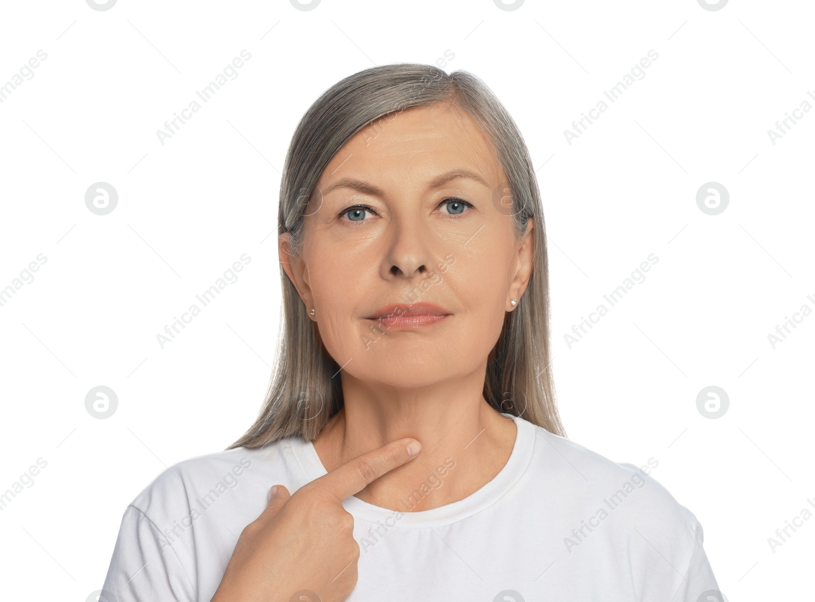 Photo of Endocrine system. Senior woman doing thyroid self examination on white background