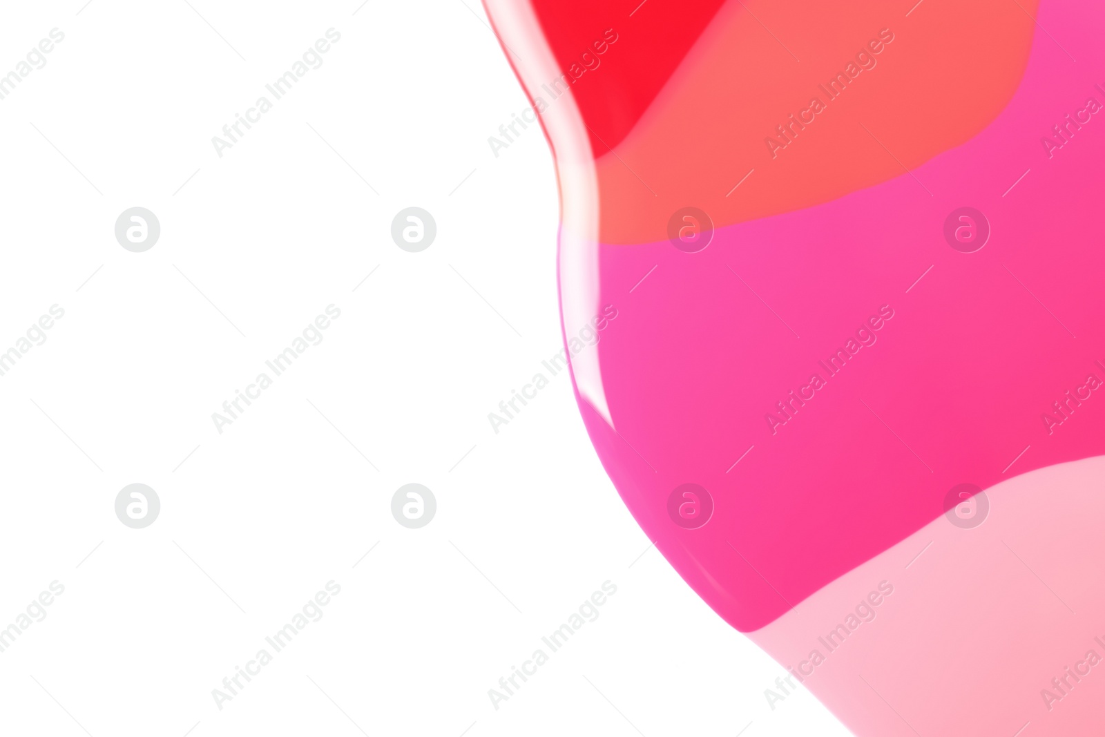 Photo of Spilled different nail polishes on white background