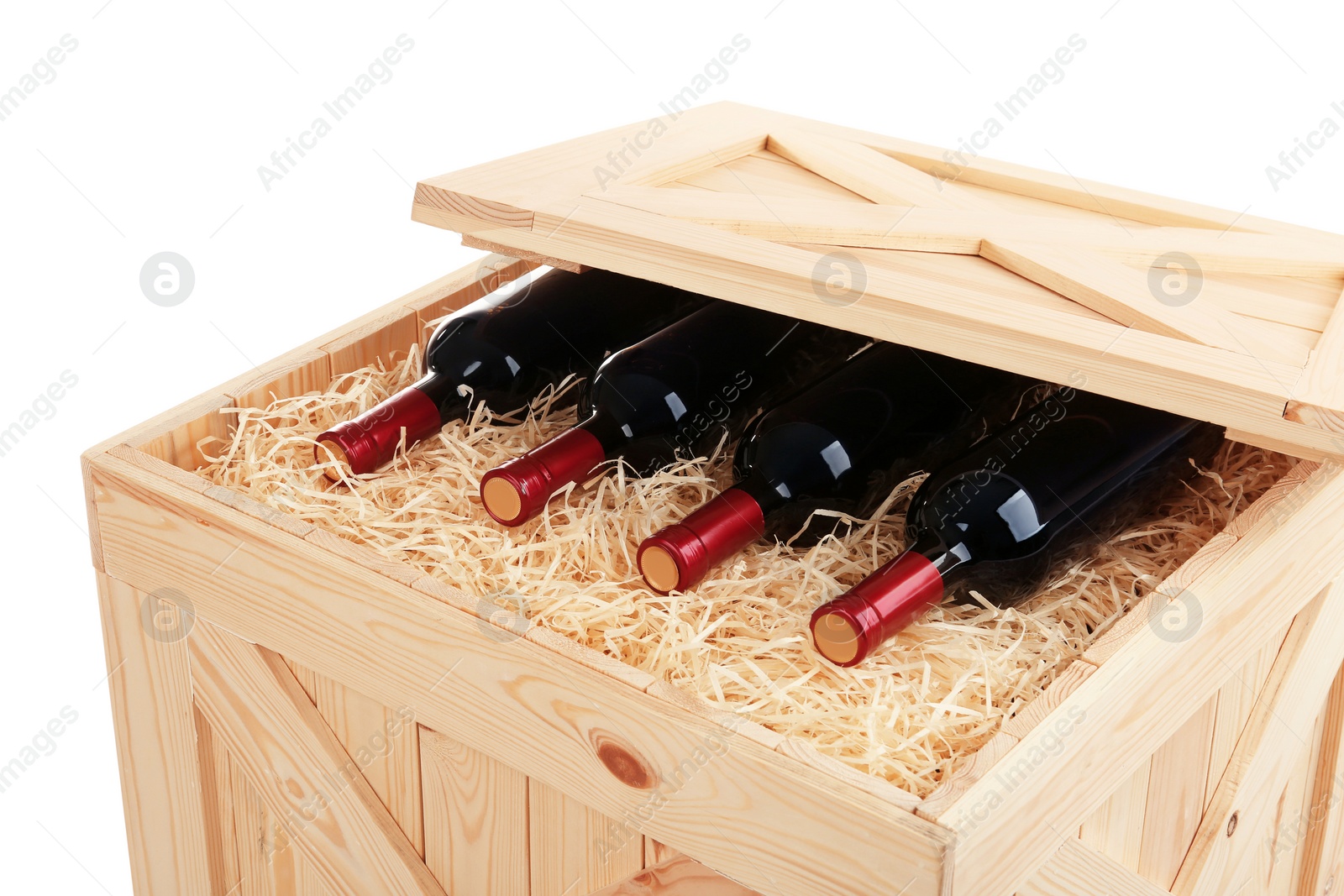 Photo of Wooden crate with bottles of wine isolated on white, closeup