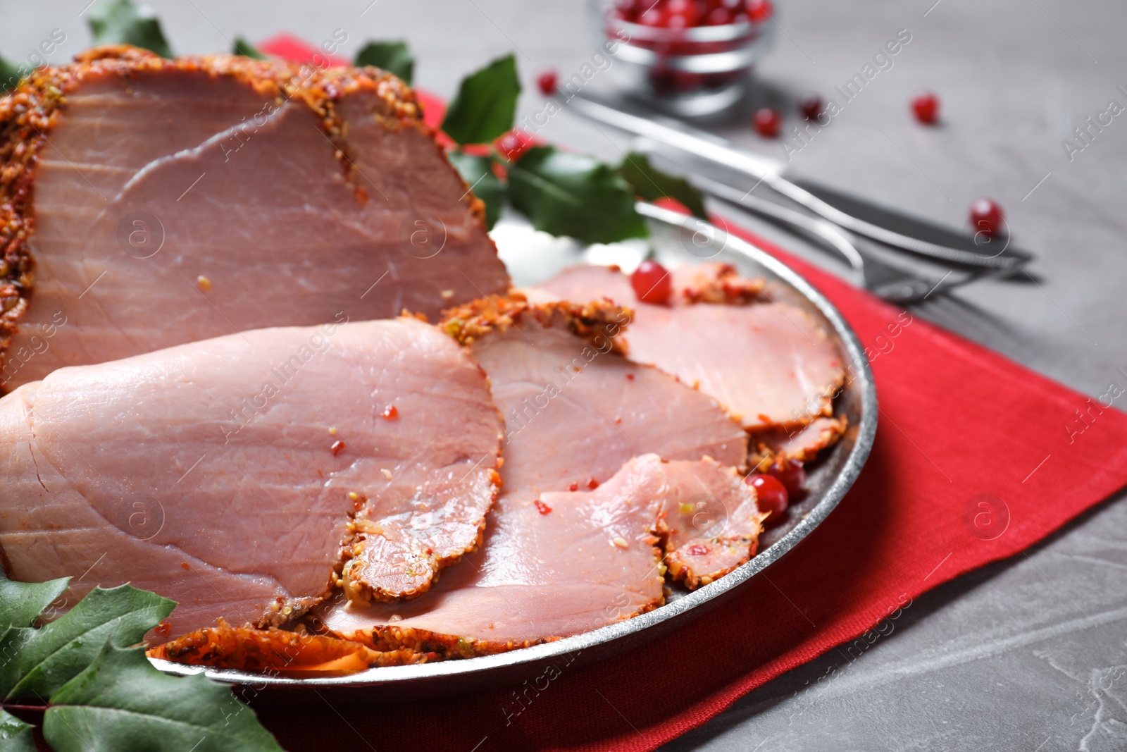 Photo of Plate with delicious ham on grey table, closeup. Christmas dinner