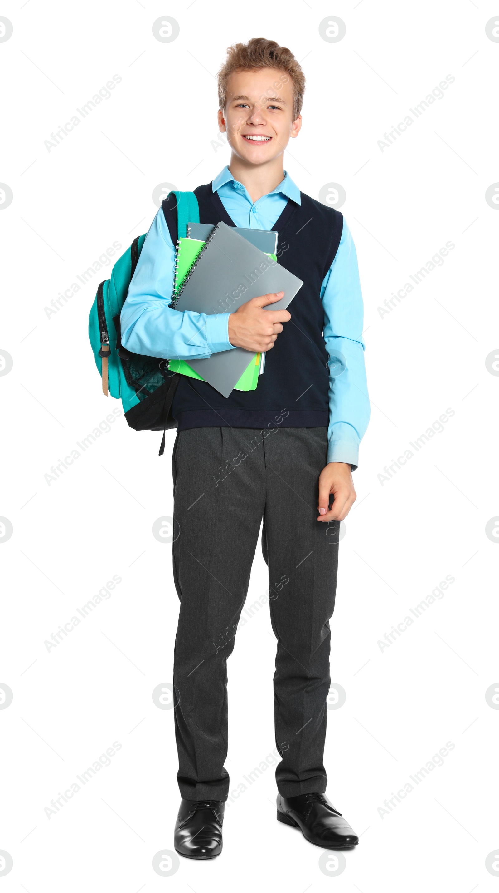 Photo of Happy boy in school uniform on white background