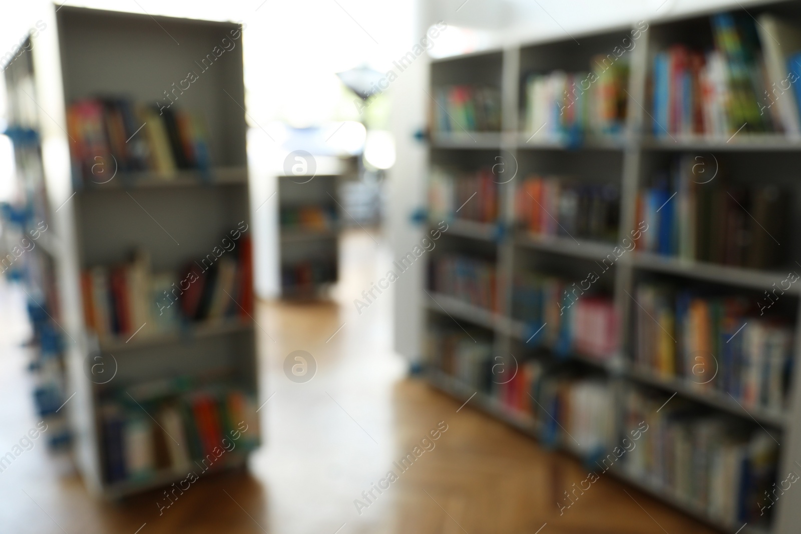 Photo of Blurred view of library interior with bookcases