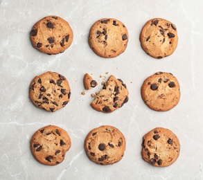 Flat lay composition with chocolate cookies on gray background