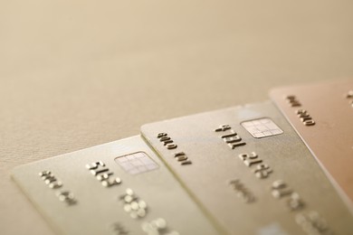 Different credit cards on table, closeup view. Space for text