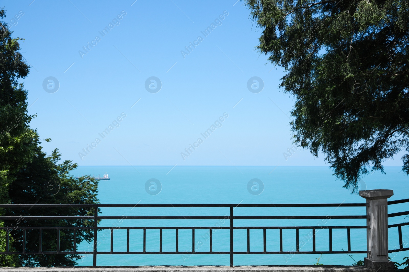 Photo of Picturesque view of beautiful sea and fence on sunny day